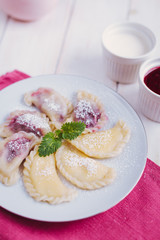 Homemade dumplings with cherries and cottage cheese