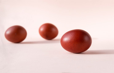 brown boiled Easter eggs on beige background