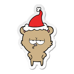 bored bear sticker cartoon of a wearing santa hat