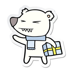 sticker of a cartoon angry polar bear with xmas present