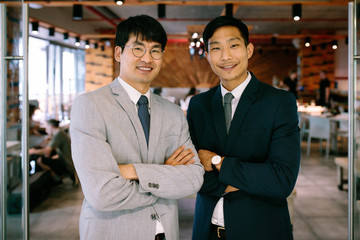 Successful business partners standing together