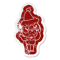 cartoon distressed sticker of a man with beard wearing santa hat