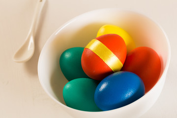easter eggs on white wooden desk