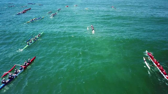 Aerial over outrigger canoes racing in a rowing race on the Pacific ocean near Ventura, California.