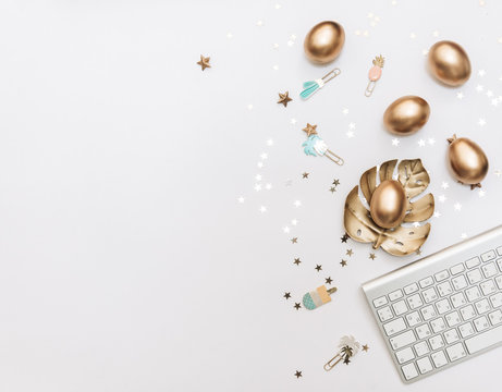 Happy Easter! Stylish stationery background with gold eggs on white background. Table decorating for holiday. Feminine flat lay. Blog easter concept.