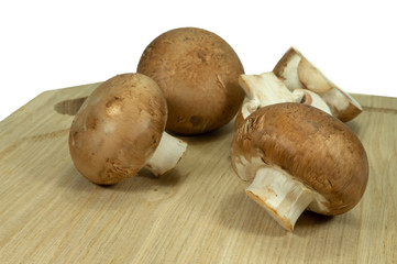 Fresh whole and halved brown Baby Bella mushrooms