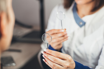 Lenses to check your vision.  ophthalmologist diagnoses  patient myopia.