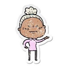 distressed sticker of a cartoon annoyed old lady