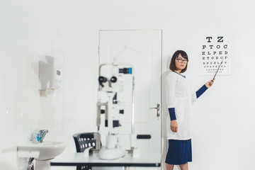 Ophthalmologist Intern in office to check your vision. Hospital, clinic, examination.