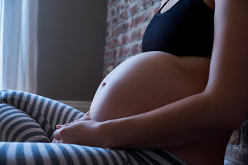 Big belly of a woman in the last months of pregnancy