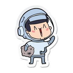 sticker of a happy cartoon astronaut with moon rock