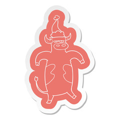 cartoon  sticker of a bull wearing santa hat