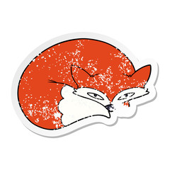 distressed sticker of a cartoon curled up fox