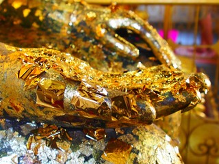 golden jewelry on black background,gold foil in temple