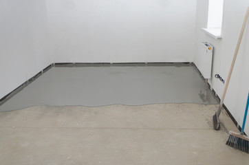 Self-leveling epoxy. Leveling with a mixture of cement floors.