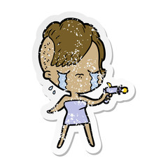 distressed sticker of a cartoon crying girl pointing ray gun