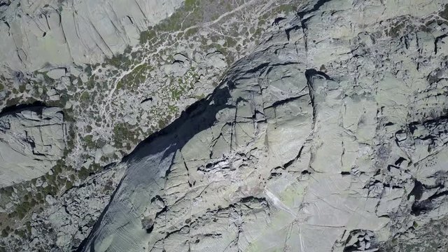 Aerial 4K Footage of "El Yelmo" rock face inside "La Pedriza" an amazing rock labyrinth at Madrid, Spain. Incredible rock formations and great place for adventure and rock climbing in wild environment