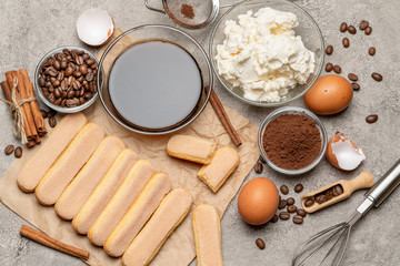 Ingredients for traditional tiramisu cake on concrete background