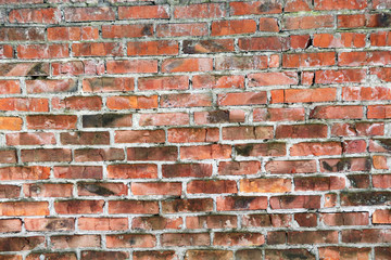 Obraz premium Old brick wall, old texture of red stone blocks closeup 