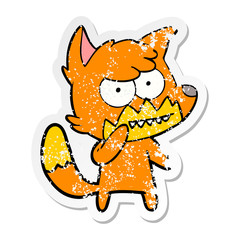 distressed sticker of a cartoon grinning fox