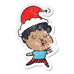 distressed sticker cartoon of a man singing wearing santa hat