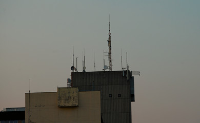 Fototapeta premium Various antennas on top of a building