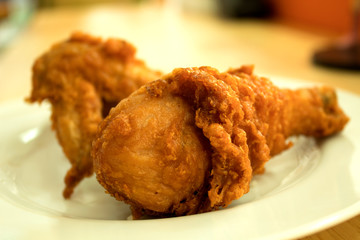 Chicken calves on the plate, background blurred