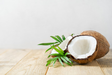 Fototapeta na wymiar Fresh coconut with leaves on white background