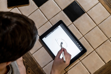person use tablet during lunch in cafe b
