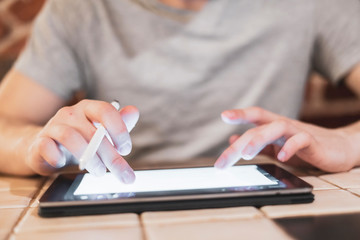 person use tablet during lunch in cafe b