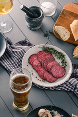 Beer, wine, salami slices