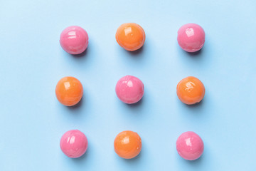 Many candies on color background