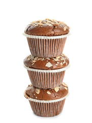 Tasty almond muffins on white background