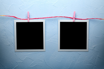 Classic photo frames on plastered wall background