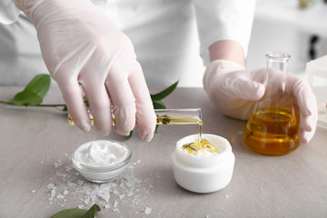 Beautician preparing natural cosmetics, closeup