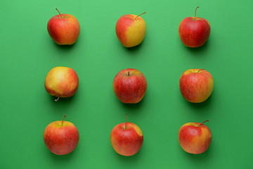 Ripe apples on color background