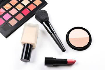 Professional makeup products with cosmetic beauty products, foundation, lipstick,  eye shadows, eye lashes, brushes and tools.