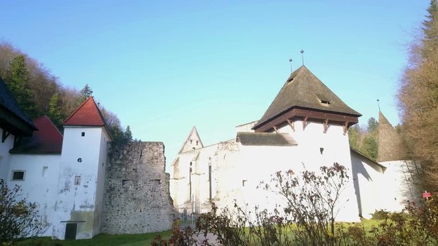 LOCE, SLOVENIA, 2019.01.25: Aerial: Flying over remainings of Zice monastery. Filming remainings of ancient French monastery Zicka kartuzija on beautiful sunny winter morning.