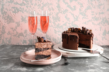 Composition with tasty chocolate cake on table