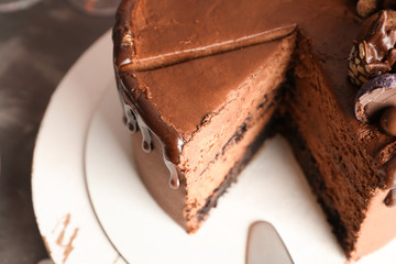Tasty chocolate cake on table, closeup