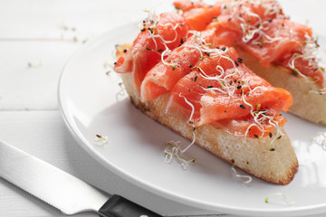 Fresh tasty bruschettas on plate, closeup