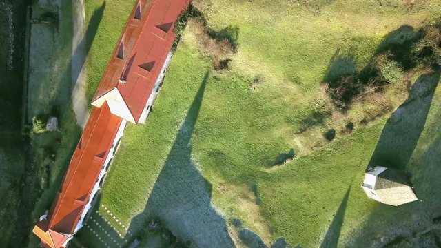 LOCE, SLOVENIA, 2019.01.25: Aerial: Flying over remainings of Zice monastery. Filming remainings of ancient French monastery Zicka kartuzija on beautiful sunny winter morning.