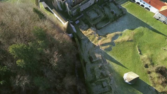 LOCE, SLOVENIA, 2019.01.25: Aerial: Flying over remainings of Zice monastery. Filming remainings of ancient French monastery Zicka kartuzija on beautiful sunny winter morning.
