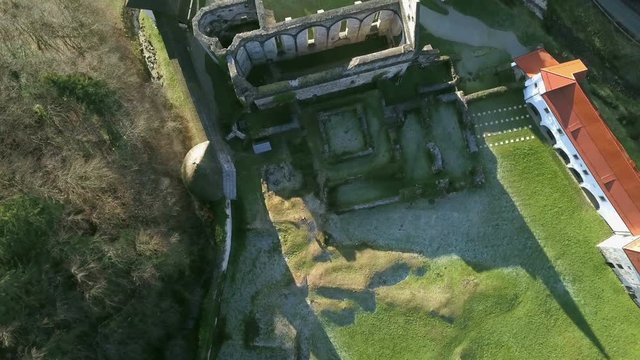 LOCE, SLOVENIA, 2019.01.25: Aerial: Flying over remainings of Zice monastery. Filming remainings of ancient French monastery Zicka kartuzija on beautiful sunny winter morning.