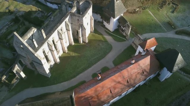 LOCE, SLOVENIA, 2019.01.25: Aerial: Flying over remainings of Zice monastery. Filming remainings of ancient French monastery Zicka kartuzija on beautiful sunny winter morning.