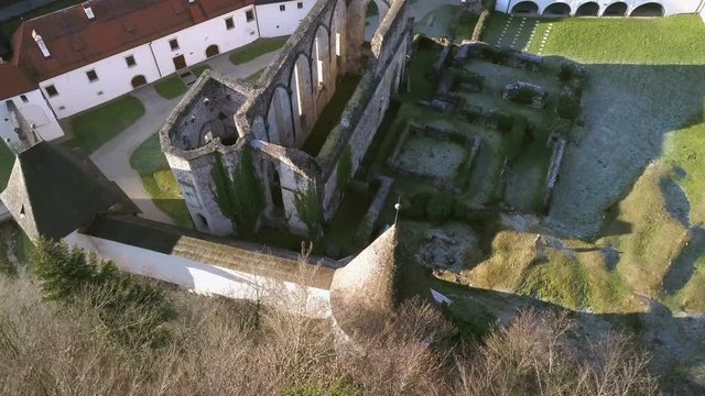 LOCE, SLOVENIA, 2019.01.25: Aerial: Flying over remainings of Zice monastery. Filming remainings of ancient French monastery Zicka kartuzija on beautiful sunny winter morning.