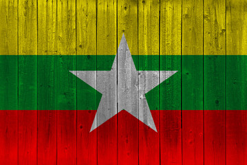 Myanmar flag painted on old wood plank