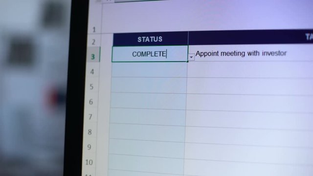 Complete status written in online daily planner, person making notes, reminder