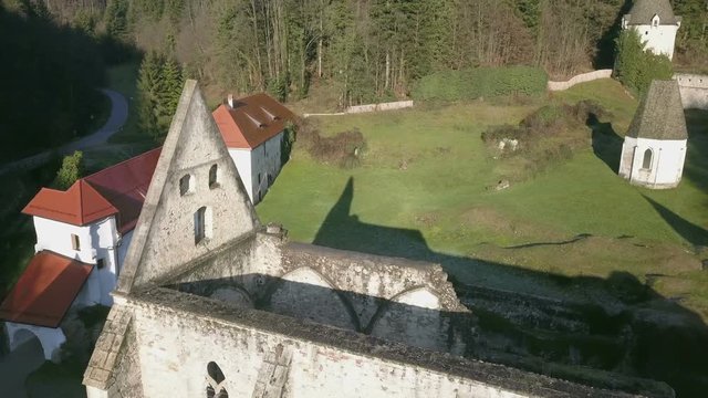 LOCE, SLOVENIA, 2019.01.25: Aerial: Ancient ruins of Zice monastery. Filming remainings of ancient French monastery on beautiful sunny winter morning.