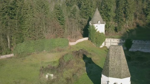 LOCE, SLOVENIA, 2019.01.25: Aerial: Flying over remainings of Zice monastery. Filming remainings of ancient French monastery Zicka kartuzija on beautiful sunny winter morning.